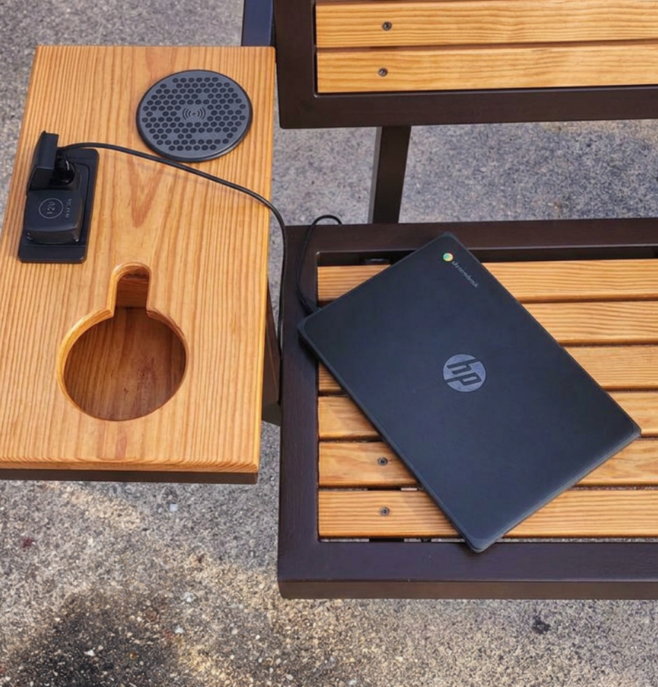 Solar bench with a closeup of charging station